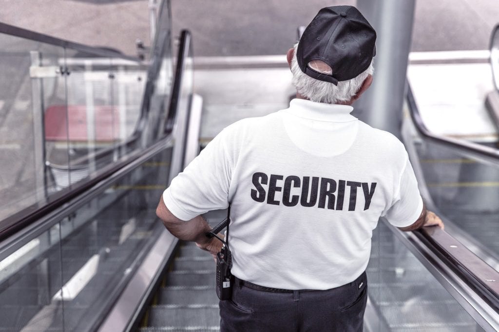 security going down escalator