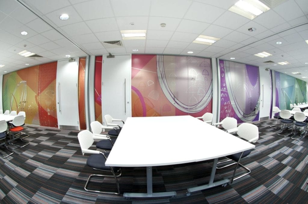 large conference room with white tbales and chairs