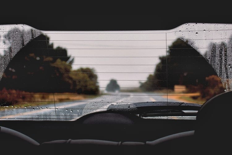 view out back car windshield in rain