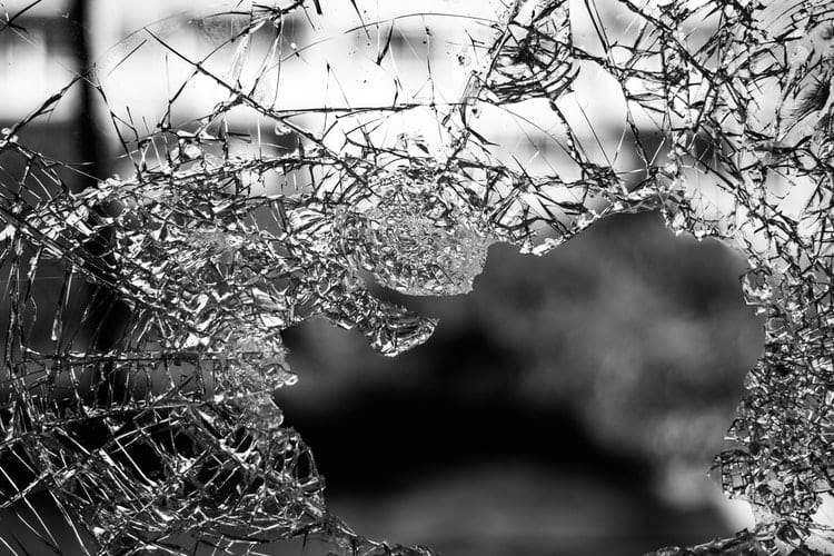 shattered glass surrounding hole