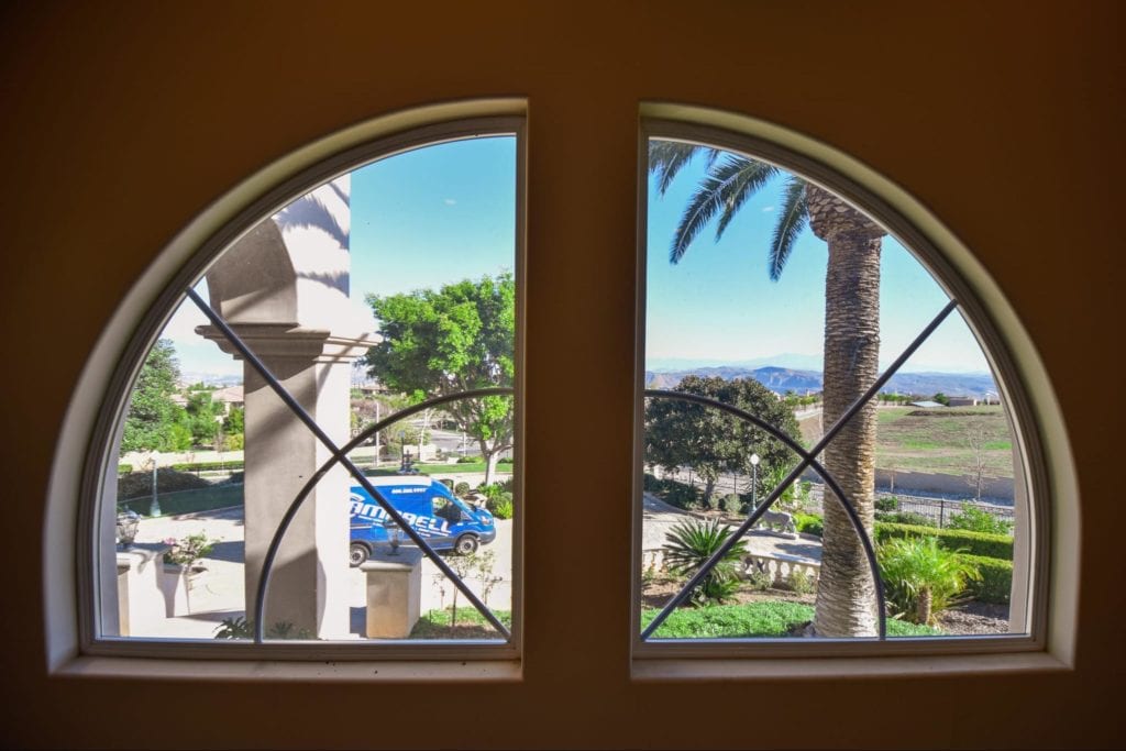 two arched windows looking outside