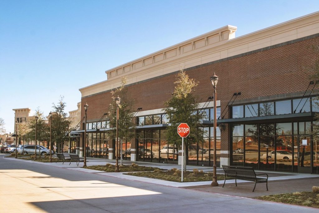 brick building with glass windows storefront