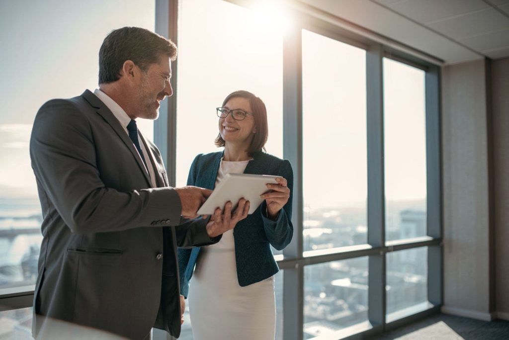 business woman and man laughing