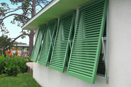 green shutters over windows on outside to protect from hurricane