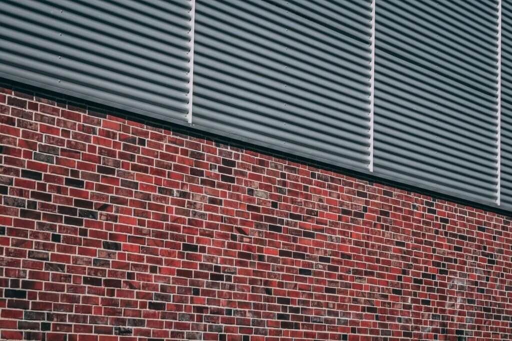 metal gates on brick wall