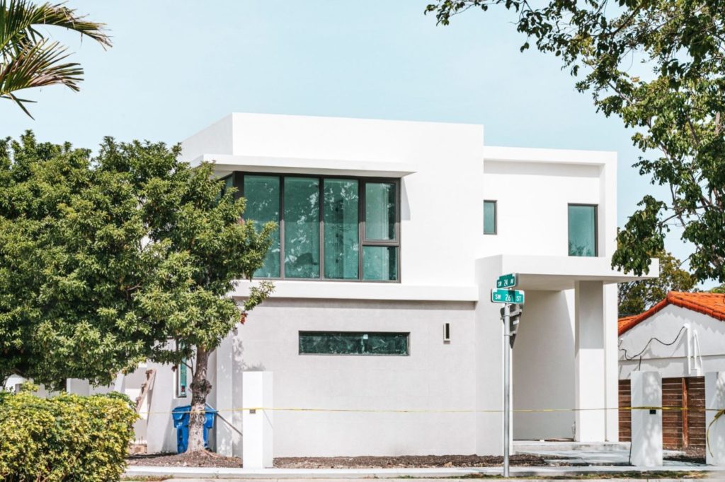 white modern home with large windows