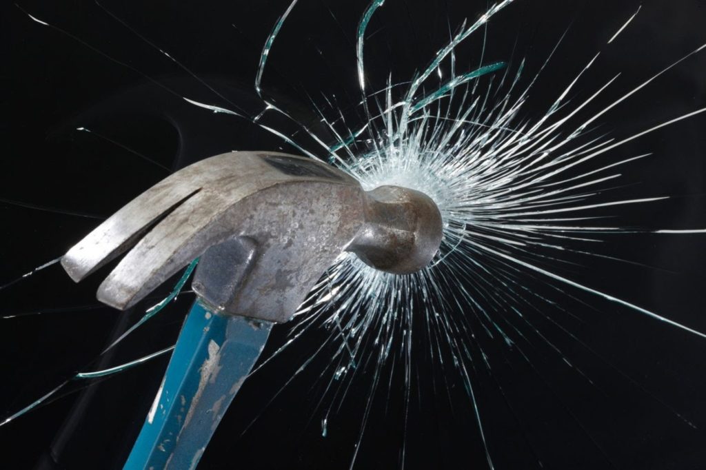 hammer hitting glass