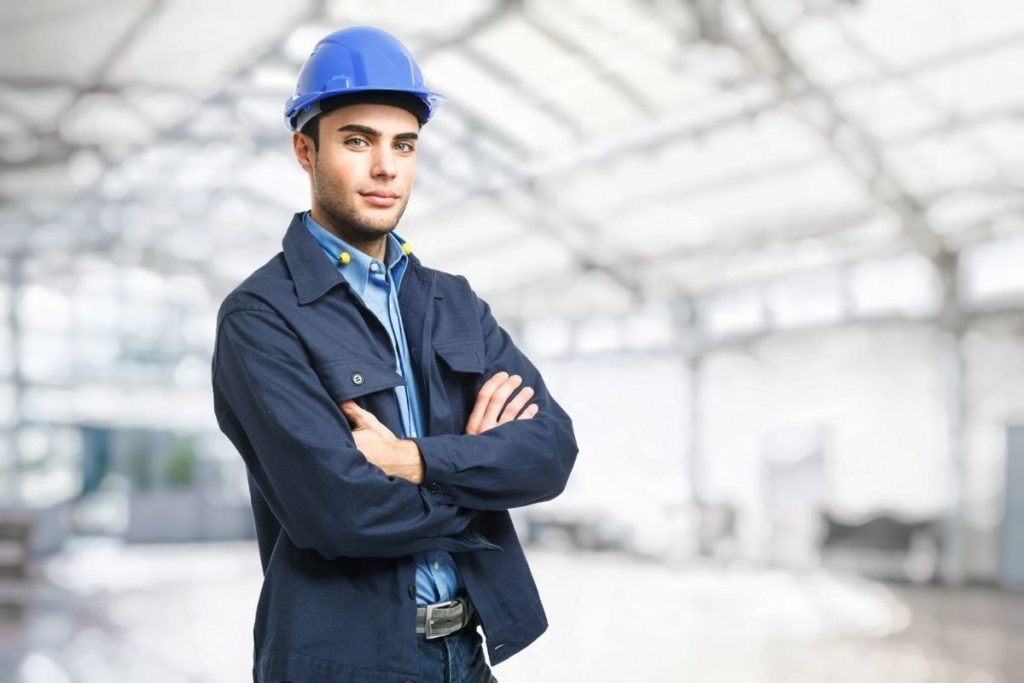 worker with a blue hardhat in a warehouse